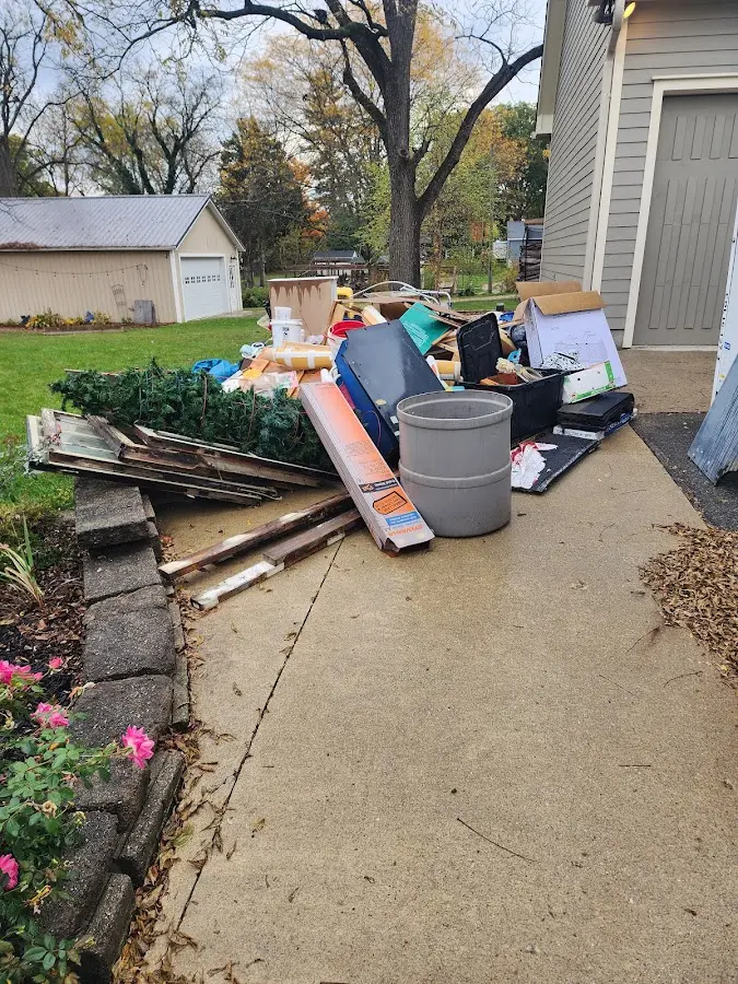 Dumpster being loaded with debris for Residential Dumpster Rental in Nashville